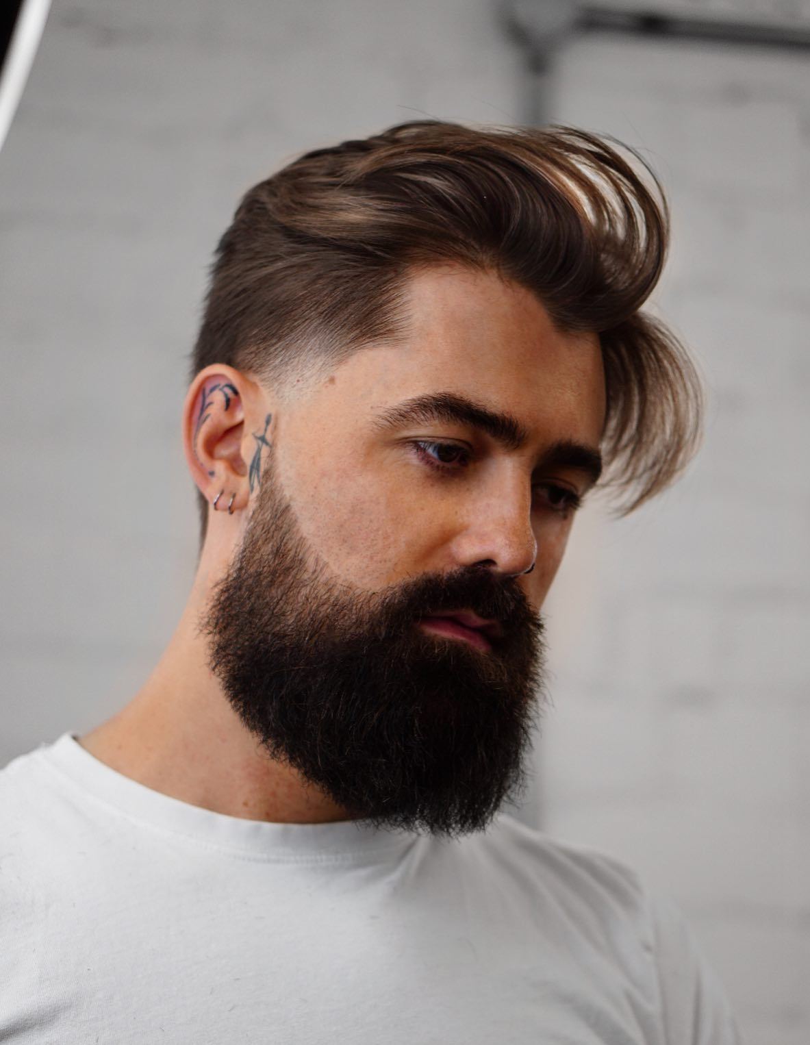 Long Top Short Sides Hairstyle with a Full Beard